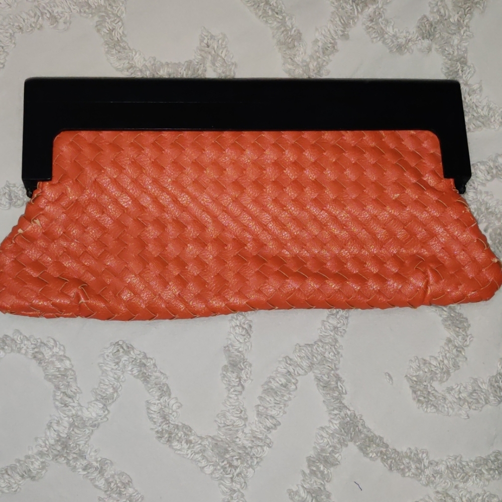 Clutch Burnt orange wood handle.